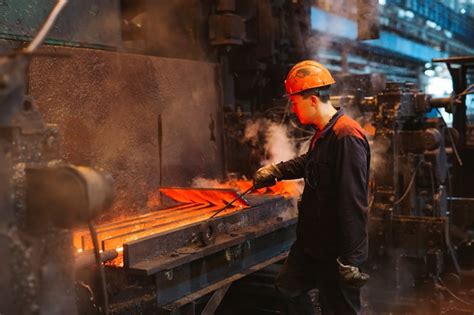 Premium Photo | Workers in the steel mill.