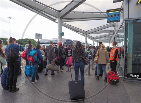 Image of Stansted, Uk - September 24, 2015: Travellers Waiting For Tranport At London Stansted ...