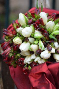 Bridesmaids bouquet .The red peruvian lilies match their dresses. Red ...