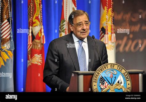 US Secretary of Defense Leon Panetta presents Army Staff Sergeant Clinton Romesha with the Medal ...