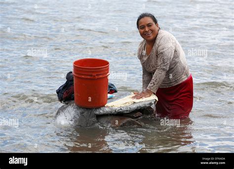 Woman washing clothes by hand hi-res stock photography and images - Alamy