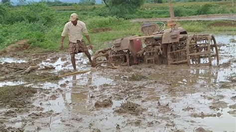 Tractor pulling out of mud when struck - YouTube