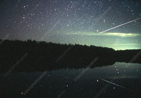 Meteor over lake - Stock Image - R305/0165 - Science Photo Library