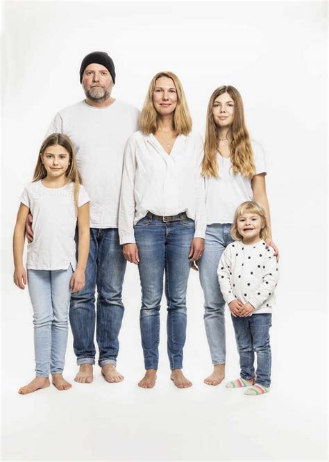 Happy family against white background in studio stock photo