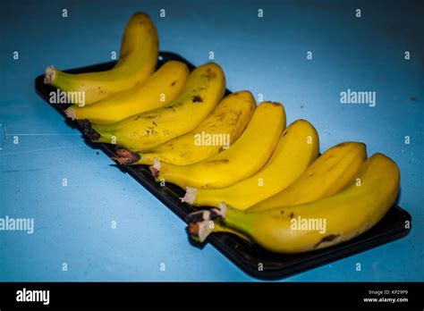 tray will seven bananas in a row Stock Photo - Alamy