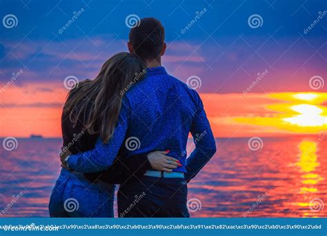 Couple in Love at Sunset by the Sea Stock Photo - Image of honeymoon, people: 119914048