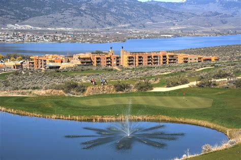 an aerial view of a golf course and water fountain