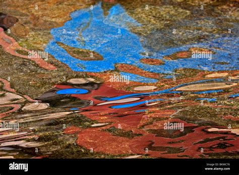 Coloured reflections on water Stock Photo - Alamy