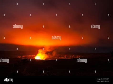 Kilauea Caldera glowing with billowing and rising gases and steam from ...