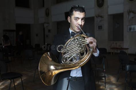 French Horn Player. Hornist Playing Brass Orchestra Music Instrument ...