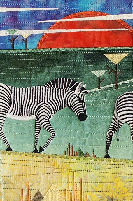 two zebras are walking in the grass