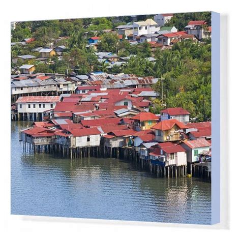 a group of houses on stilts in the water