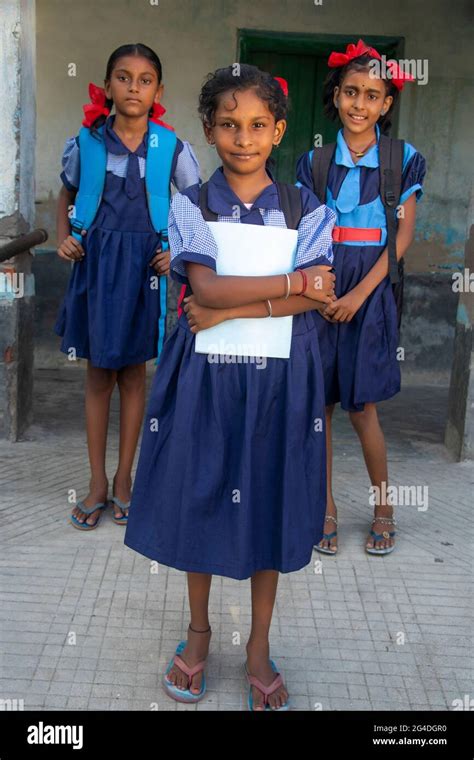 An Indian Rural School Girls wearing School Uniform Standing in school Stock Photo - Alamy