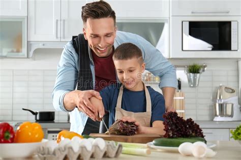 Dad and Son Cooking Together in Stock Image - Image of lifestyle, eggs: 155350341