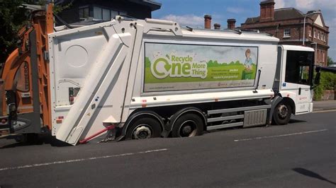 Bin lorry sinks into Newbury road - BBC News