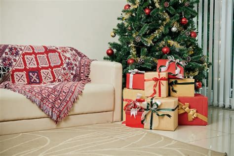 Christmas presents under tree | Premium Photo