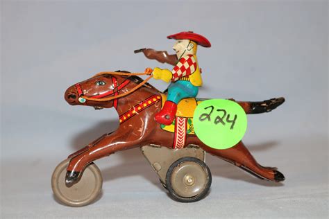 Lot - Tin horse and cowboy push toy