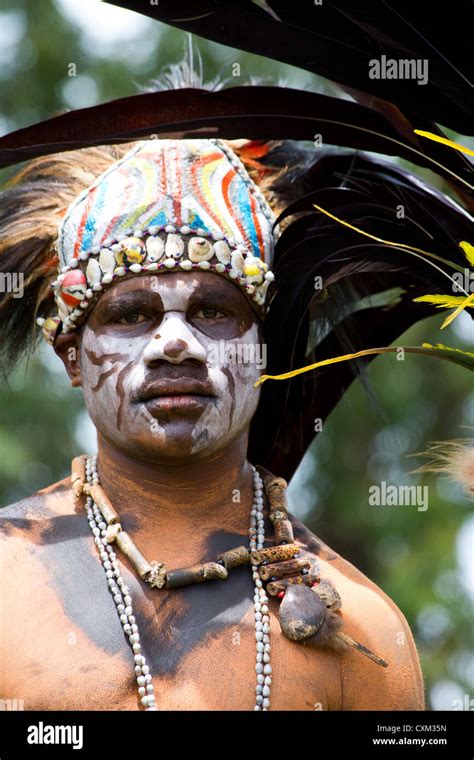 Man dressed in traditional tribal costume and headdress at the singsing ...