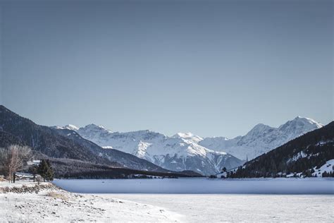 Wintertime at lake reschen | Lake, Landscape, Natural landmarks