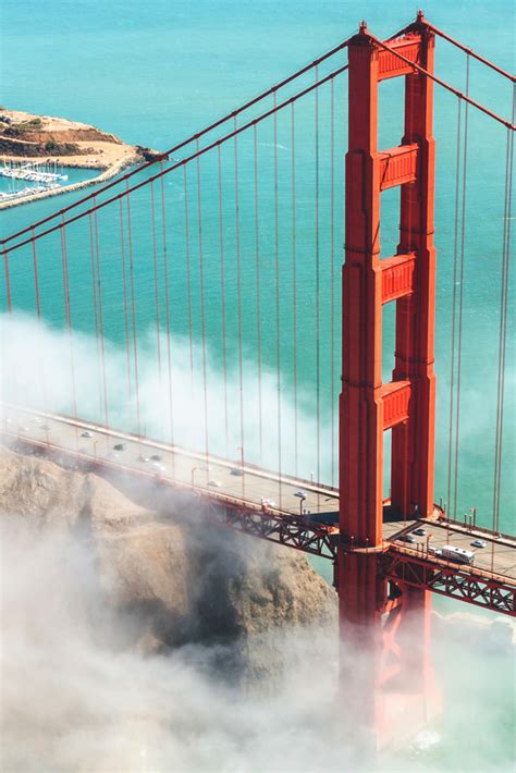 an aerial view of the golden gate bridge in san francisco, california with steam rising from below
