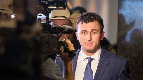 Surrounded by media during day in court, Johnny Manziel says nothing to reporters