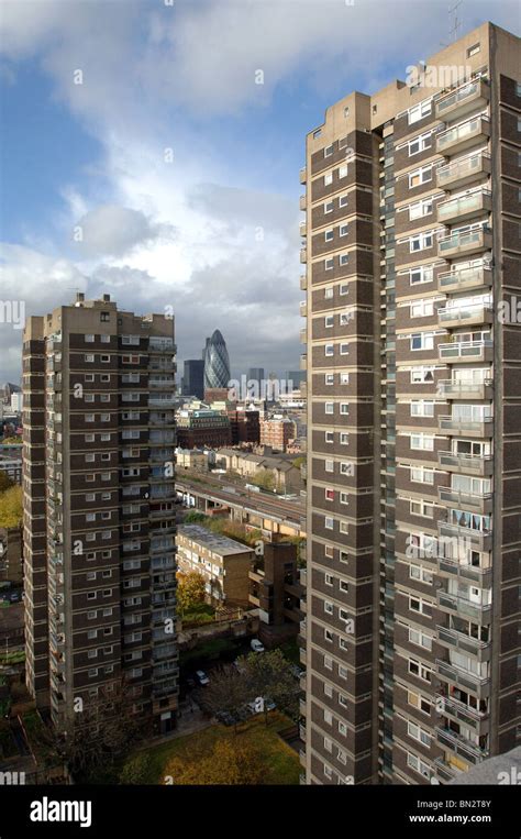 Tower block housing London with view of the Gherkin building and the ...