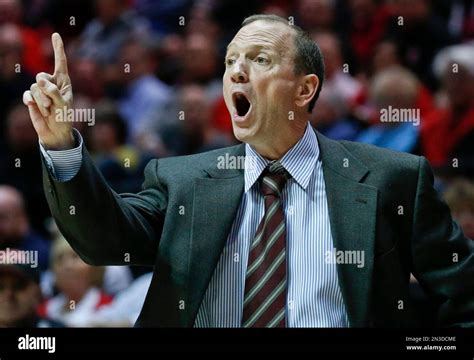 Long Beach State coach Dan Monson shouts instructions to his players ...