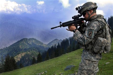 ISAF soldier looking for enemy positions in Afghanistan , April 2006 ...