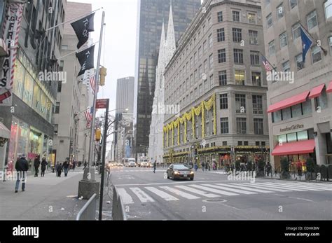 A street view of the corner of 5th Ave & 49th street in New York City ...