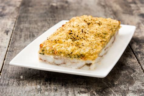 White Fish Casserole with Cheese on Blue Wood Stock Image - Image of meal, cream: 118326005