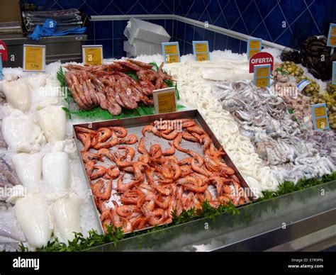 Different types of fish for sale at a market stall Stock Photo - Alamy