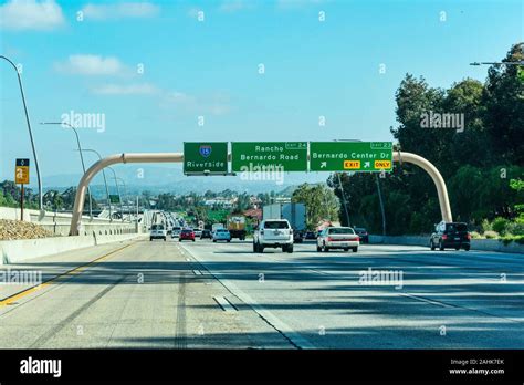 Guide signs on large overhead signage informing drivers about the ...