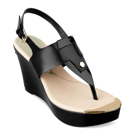 Lyst - Guess Magli Platform Wedge Thong Sandals in Black