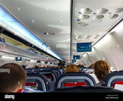 Air Berlin Boeing 737-800 interior taking off with passengers seated ...