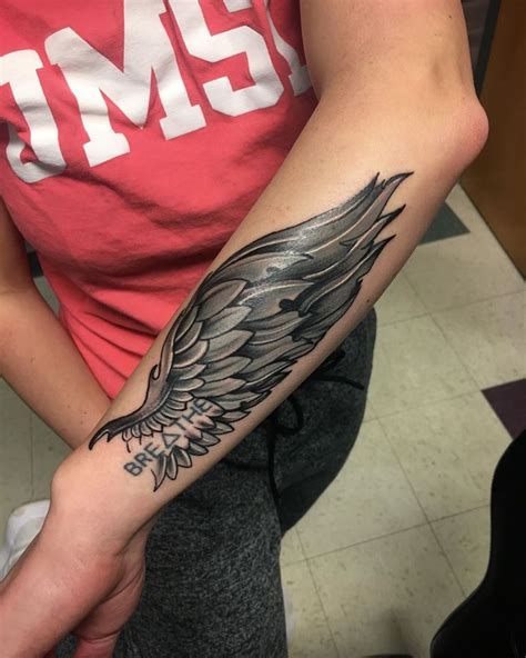 red wing tattoo meaning - Christian Garber