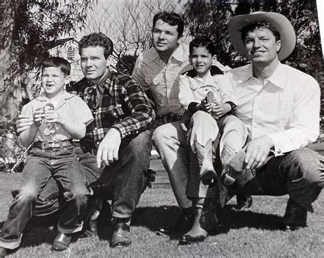 WHISPERING SMITH (NBC-TV) starring Audie Murphy (middle) & Guy Mitchell (right) poses with kids ...