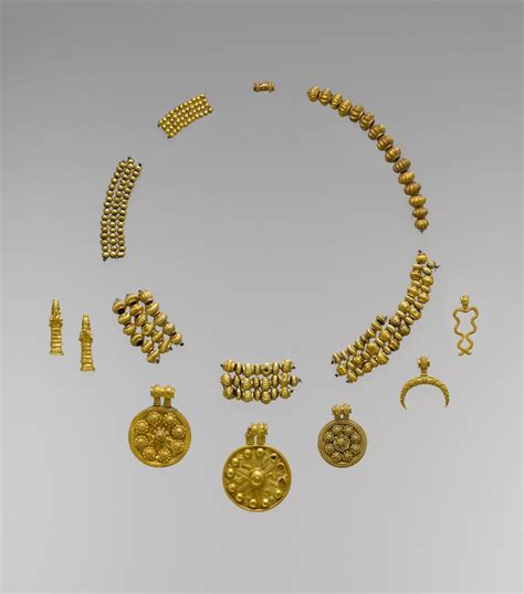 These gold pendants and beads exemplify the finest craftsmanship in ...