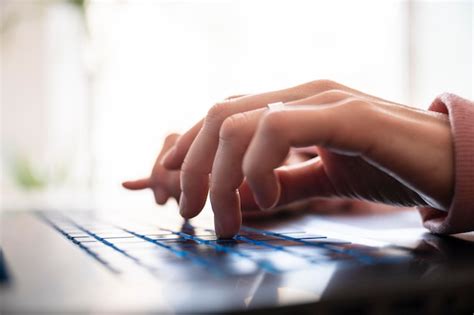 Premium Photo | Low angle closeup view of female hands typing on laptop ...