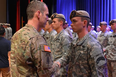 Like father, like son. Pvt. Howard Urban is congratulated by his father Sgt. Maj. Howard Urban ...