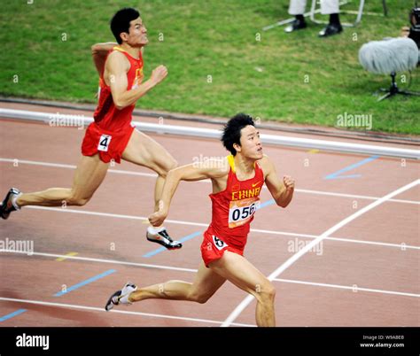 Chinas star hurdler Liu Xiang, front, dashes to the line in the mens ...