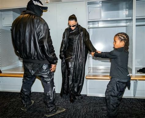 Kim Kardashian pictured getting cozy with Kanye West backstage at his Donda listening party (photos)