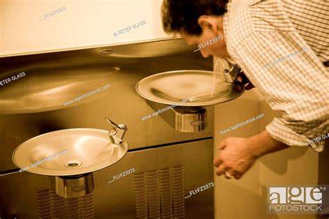 Man drinking from water fountain, Stock Photo, Picture And Rights ...