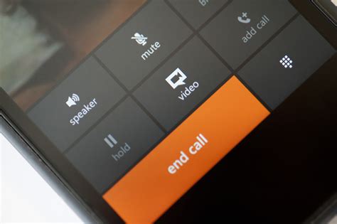 Free Image of Orange End Call Button on a Black Mobile Phone | Freebie.Photography