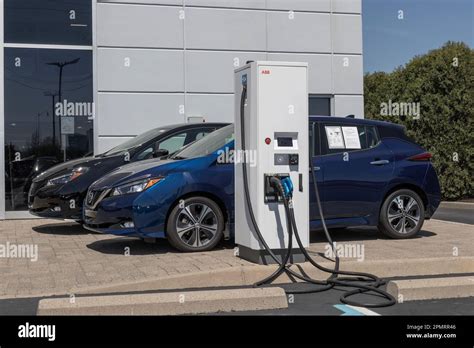 Indianapolis - Circa April 2023: Nissan Leaf display with an ABB EV Electric Vehicle Charger ...