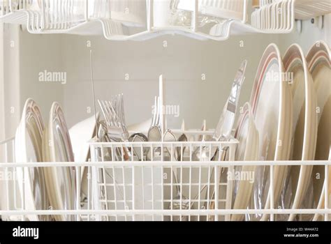 The interior of a dishwasher after a clean cycle Stock Photo - Alamy