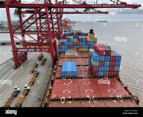 Hatch covers of the container vessel partly loaded with containers ...