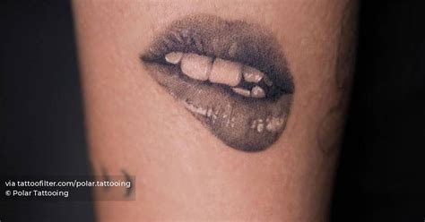 Black and grey style lips tattoo located on the upper