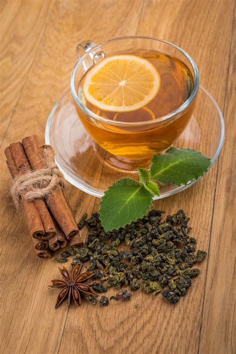 Cup of Tea with Mint, Cinnamon and Tea Leaves Stock Image - Image of ...