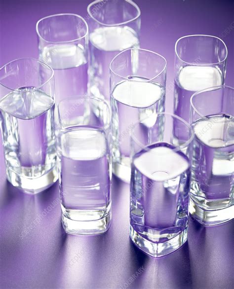 Eight glasses of water - Stock Image - H110/2151 - Science Photo Library