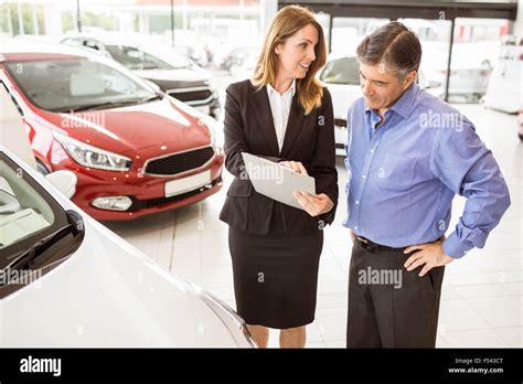 Smiling businessman undersign a car contract Stock Photo - Alamy